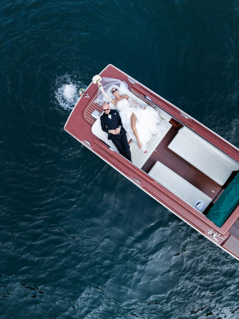 A couple on board a boat near Villa del Balbianello.